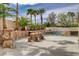 The outdoor kitchen and swimming pool create a private backyard retreat at 2073 Sapphire Valley Ave, Henderson, NV 89074