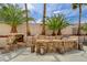 An outdoor kitchen with grill and bar seating provide an ideal space for enjoying outdoor activities at 2073 Sapphire Valley Ave, Henderson, NV 89074