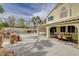 Outdoor kitchen and seating area next to the covered patio is perfect for dining and entertaining at 2073 Sapphire Valley Ave, Henderson, NV 89074