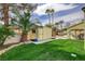 A lush lawn and outdoor kitchen with grill complete the well-maintained backyard at 2073 Sapphire Valley Ave, Henderson, NV 89074
