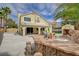 An impressive backyard with an outdoor kitchen, patio, and well-manicured landscaping create an excellent space for outdoor entertaining at 2073 Sapphire Valley Ave, Henderson, NV 89074