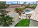 An outdoor view of a home with a basketball court, pool, shed, and patio area at 2073 Sapphire Valley Ave, Henderson, NV 89074