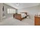 Bright bedroom with vaulted ceilings, neutral carpet, and a large window at 2073 Sapphire Valley Ave, Henderson, NV 89074