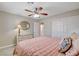 Cozy bedroom with a ceiling fan, neutral walls, and carpet flooring at 2073 Sapphire Valley Ave, Henderson, NV 89074