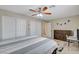 Well-lit bedroom with dual closets, light walls, and carpet flooring at 2073 Sapphire Valley Ave, Henderson, NV 89074