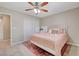 Bedroom featuring a light pink bed, patterned rug, and double-door closet at 2073 Sapphire Valley Ave, Henderson, NV 89074