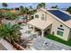Exterior view showcasing a well-maintained home with a private pool, backyard, and solar panels at 2073 Sapphire Valley Ave, Henderson, NV 89074