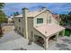 Exterior elevation features tile roof, covered patio, neutral stucco, and large driveway at 2073 Sapphire Valley Ave, Henderson, NV 89074