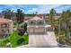 Charming two-story home with a well-manicured lawn, a two-car garage, and desert landscaping at 2073 Sapphire Valley Ave, Henderson, NV 89074
