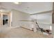 Upstairs hallway with wood and white banister overlooking the living room below at 2073 Sapphire Valley Ave, Henderson, NV 89074