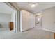 Spacious hallway with built-in storage cabinets and neutral carpeting at 2073 Sapphire Valley Ave, Henderson, NV 89074