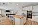 Bright kitchen with an island with butcher block countertop and stainless steel appliances at 2073 Sapphire Valley Ave, Henderson, NV 89074