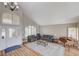 Inviting living room with vaulted ceiling, hardwood floors, neutral colors, and lots of natural light at 2073 Sapphire Valley Ave, Henderson, NV 89074