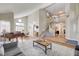 Open-concept living room with hardwood floors, neutral colors, and staircase at 2073 Sapphire Valley Ave, Henderson, NV 89074