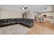 Open-concept living room and kitchen with wood floors and modern furnishings at 2073 Sapphire Valley Ave, Henderson, NV 89074