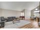 Spacious living room with vaulted ceiling, hardwood floors, neutral colors, and lots of natural light at 2073 Sapphire Valley Ave, Henderson, NV 89074