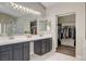 Bright main bathroom with dual sinks and access to the walk-in closet at 2073 Sapphire Valley Ave, Henderson, NV 89074