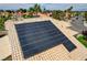 Roof with solar panels on a residence in a neighborhood of similar homes, with palm trees and distant city view at 2073 Sapphire Valley Ave, Henderson, NV 89074