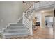 Bright staircase with carpeted steps and hardwood floors leading to the main floor at 2073 Sapphire Valley Ave, Henderson, NV 89074