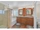 A spacious full bathroom with soaking tub, shower, and dual vanity with granite countertops at 2324 Babcock Dr, Las Vegas, NV 89134