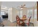 Charming dining area with a round table, decorative chairs, and bright natural light from windows at 2324 Babcock Dr, Las Vegas, NV 89134