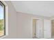 Bedroom with white doors, neutral paint, and a bright window at 24 Painted View St, Henderson, NV 89012