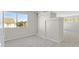 Bonus room with modern build ins, neutral carpet, and natural light at 24 Painted View St, Henderson, NV 89012