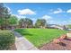 Well-maintained community park with lush green grass, walking path, and covered gazebo for outdoor enjoyment at 24 Painted View St, Henderson, NV 89012