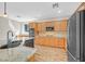 Kitchen boasts stainless appliances, granite counters, and an island with a sink and seating area at 24 Painted View St, Henderson, NV 89012