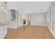Spacious living room featuring a fireplace, hardwood floors, and a staircase leading to the upper level at 24 Painted View St, Henderson, NV 89012