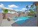 Backyard pool and spa surrounded by a brick wall providing privacy and accented with desert landscaping at 24 Painted View St, Henderson, NV 89012