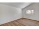 Simple bedroom featuring wood floors and a sunny window at 2685 S Tenaya Way, Las Vegas, NV 89117