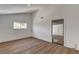 Bedroom features wood floors, a window, and access to a spacious walk-in closet at 2685 S Tenaya Way, Las Vegas, NV 89117