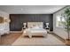 Bright bedroom with a modern accent wall and stylish decor at 2685 S Tenaya Way, Las Vegas, NV 89117