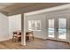 Bright dining area adjacent to the pool, featuring hardwood floors and natural light at 2685 S Tenaya Way, Las Vegas, NV 89117