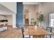 Stylish dining room features open floor plan, wood floors, and seamless flow to kitchen at 2685 S Tenaya Way, Las Vegas, NV 89117