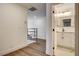 Hallway features new wood flooring, and access to a bathroom with new vanity at 2685 S Tenaya Way, Las Vegas, NV 89117