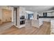 Spacious kitchen with eat-in island, stainless appliances and seamless flow to dining area at 2685 S Tenaya Way, Las Vegas, NV 89117