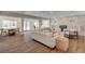 Open-concept living area with sleek flooring, modern furniture, and bright natural light at 2685 S Tenaya Way, Las Vegas, NV 89117