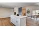Open floor plan with a bright kitchen island and dining space at 2685 S Tenaya Way, Las Vegas, NV 89117