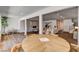 Open living space featuring sleek flooring, ample lighting, and a cozy dining area at 2685 S Tenaya Way, Las Vegas, NV 89117