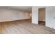 Spacious living room features new wood flooring, recessed lighting, and neutral paint at 2685 S Tenaya Way, Las Vegas, NV 89117