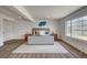 Bright main bedroom with a large window, neutral decor, and a calming, spacious interior at 2685 S Tenaya Way, Las Vegas, NV 89117