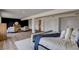 Spacious main bedroom with seating, and a stylish bedroom design featuring a paneled accent wall at 2685 S Tenaya Way, Las Vegas, NV 89117