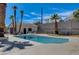 Inviting pool with concrete surround and pool house offers a backyard oasis, perfect for relaxation and outdoor enjoyment at 2685 S Tenaya Way, Las Vegas, NV 89117
