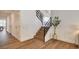 Modern staircase with wood steps, black railing, and ample natural light at 2685 S Tenaya Way, Las Vegas, NV 89117