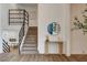 Inviting staircase with wooden steps and black metal railing, leading to the upper level at 2685 S Tenaya Way, Las Vegas, NV 89117