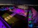 Backyard pool area illuminated with colorful lights, creating an inviting ambiance at 270 Shaded Canyon Dr, Henderson, NV 89012