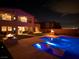 Stunning backyard with a sparkling pool, spa, fire pits, and outdoor seating for ultimate relaxation and entertainment at 270 Shaded Canyon Dr, Henderson, NV 89012