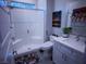 Modern bathroom features a walk-in shower with glass door, white vanity, and ceramic toilet at 270 Shaded Canyon Dr, Henderson, NV 89012